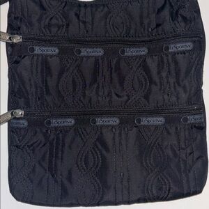 LESPORT SAC BLACK NYLON CROSSBODY BAG 2 ZIP POCKETS ON ONE SIDE ADJUSTABLE STRAP